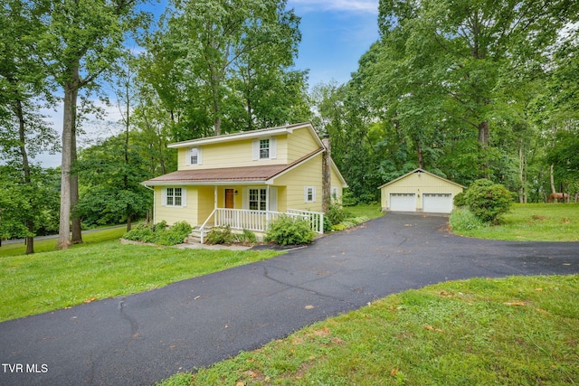 319 Woodland Rd, Jonesborough, TN 37659 - traditional home featuring an outdoor structure, a porch, a garage, and a front yard