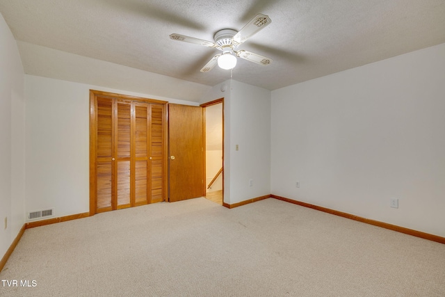 319 Woodland Rd, Jonesborough, TN 37659 - unfurnished bedroom with baseboards, carpet, a closet, and a textured ceiling