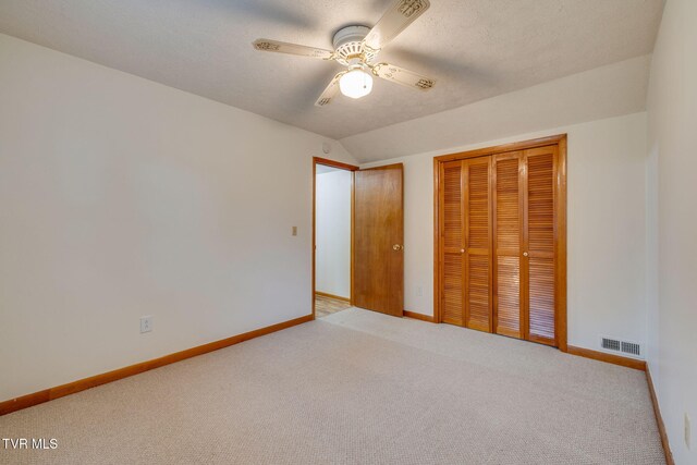 319 Woodland Rd, Jonesborough, TN 37659 - unfurnished bedroom with carpet floors, a closet, baseboards, vaulted ceiling, and a ceiling fan
