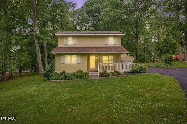 319 Woodland Rd, Jonesborough, TN 37659 - view of front of property with covered porch, a front lawn, asphalt driveway, and metal roof
