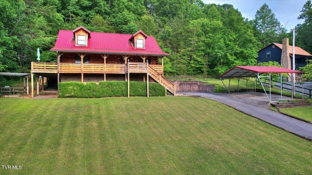 209 Brystone Dr, Gray, TN 37615 - back of property featuring a detached carport, metal roof, stairs, and a forest view