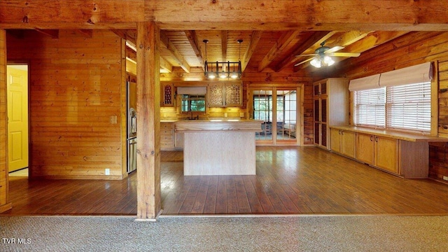 209 Brystone Dr, Gray, TN 37615 - kitchen with wooden walls, hardwood / wood-style flooring, a kitchen island, wood ceiling with exposed beams, and a ceiling fan