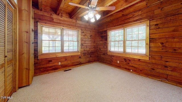 209 Brystone Dr, Gray, TN 37615 - unfurnished room with wood ceiling with exposed beams, wooden walls, light colored carpet, and a ceiling fan