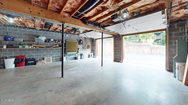 209 Brystone Dr, Gray, TN 37615 - garage featuring a garage door opener and concrete block wall