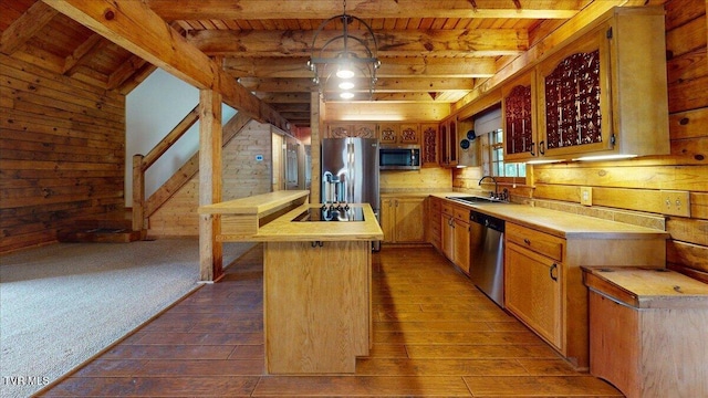 209 Brystone Dr, Gray, TN 37615 - kitchen featuring appliances with stainless steel finishes, dark wood-style floors, wooden ceiling with exposed beams, light countertops, and wooden walls