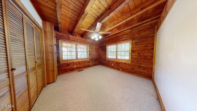 209 Brystone Dr, Gray, TN 37615 - unfurnished bedroom featuring wood ceiling with exposed beams, wood walls, light carpet, a closet, and a ceiling fan