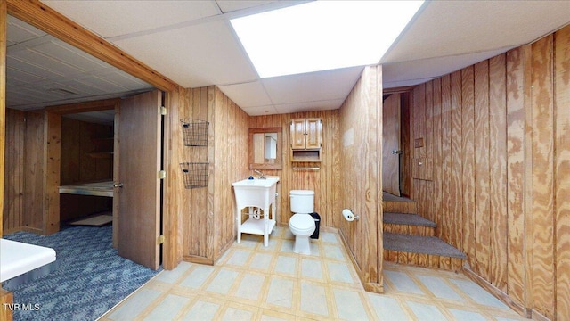 209 Brystone Dr, Gray, TN 37615 - bathroom with wooden walls, tile patterned floors, toilet, and a paneled ceiling