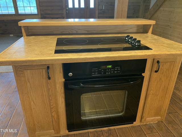 209 Brystone Dr, Gray, TN 37615 - kitchen view of black appliances, tile counters, and wood finished floors