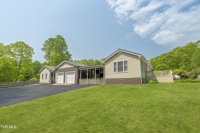 9266 Forest Rd, Coeburn, VA 24230 - view of front of home with a garage, driveway, a front lawn, and crawl space