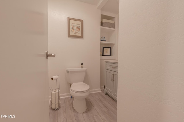 9266 Forest Rd, Coeburn, VA 24230 - bathroom with toilet, wood finished floors, and baseboards