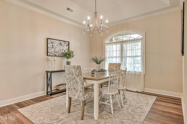 302 Charlton Ct, Bluff City, TN 37618 - dining room featuring a chandelier, ornamental molding, baseboards, and wood finished floors