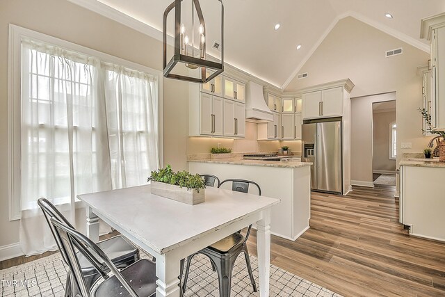 302 Charlton Ct, Bluff City, TN 37618 - dining space featuring wood finished floors, baseboards, recessed lighting, and high vaulted ceiling