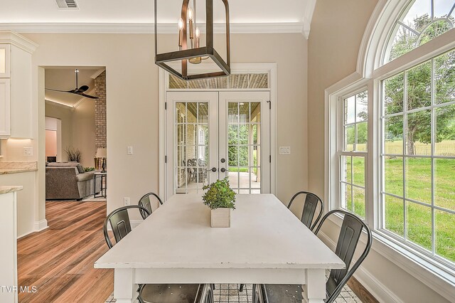 302 Charlton Ct, Bluff City, TN 37618 - dining room with french doors, ornamental molding, light wood finished floors, ceiling fan, and baseboards