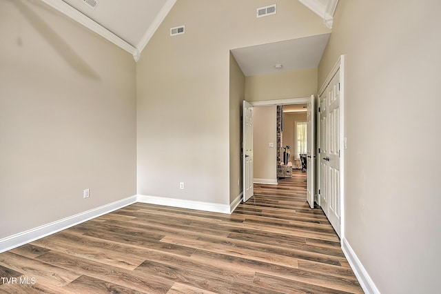 302 Charlton Ct, Bluff City, TN 37618 - unfurnished room with ornamental molding, wood finished floors, baseboards, and high vaulted ceiling