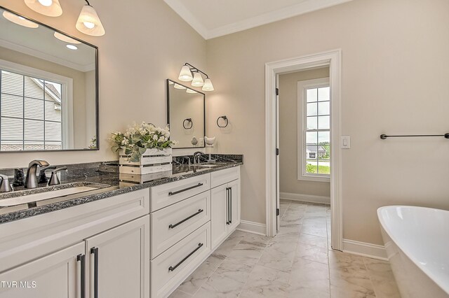 302 Charlton Ct, Bluff City, TN 37618 - full bath featuring marble look tiles, double vanity, ornamental molding, a freestanding bath, and baseboards