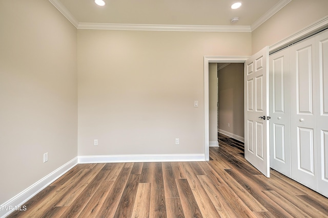 302 Charlton Ct, Bluff City, TN 37618 - unfurnished bedroom with ornamental molding, wood finished floors, recessed lighting, baseboards, and a closet