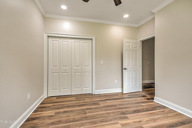 302 Charlton Ct, Bluff City, TN 37618 - unfurnished bedroom featuring crown molding, wood finished floors, a closet, baseboards, and recessed lighting