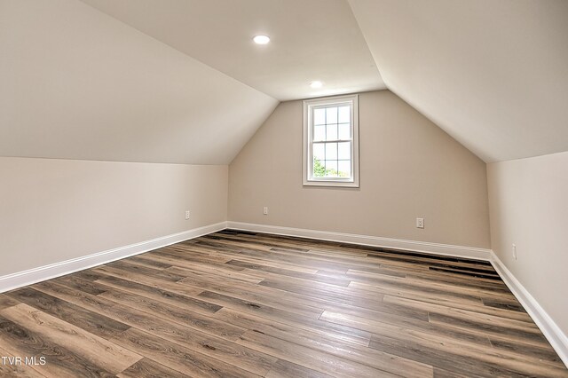 302 Charlton Ct, Bluff City, TN 37618 - additional living space with dark wood finished floors, vaulted ceiling, baseboards, and recessed lighting