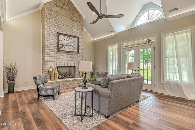 302 Charlton Ct, Bluff City, TN 37618 - living area with ceiling fan, wood finished floors, a fireplace, high vaulted ceiling, and baseboards