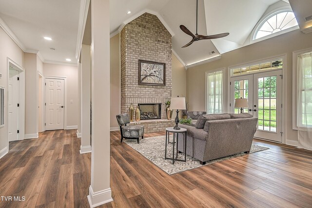 302 Charlton Ct, Bluff City, TN 37618 - living room with ceiling fan, vaulted ceiling, wood finished floors, a brick fireplace, and french doors