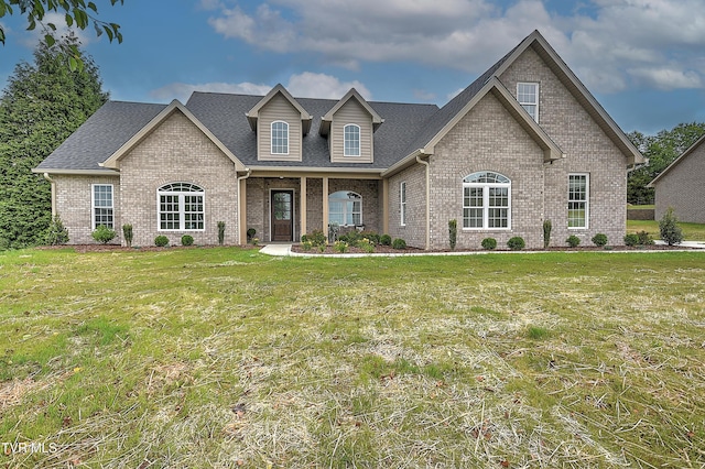 302 Charlton Ct, Bluff City, TN 37618 - view of front facade featuring brick siding, a front yard, and roof with shingles