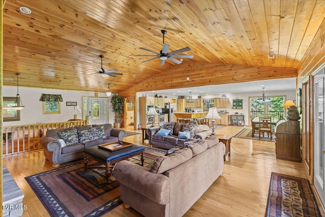 2213 Woodcock Trl, Sevierville, TN 37876 - living area featuring vaulted ceiling, wood ceiling, light wood-style floors, ceiling fan, and healthy amount of natural light