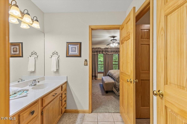 2213 Woodcock Trl, Sevierville, TN 37876 - bathroom featuring vanity, connected bathroom, tile patterned floors, baseboards, and a ceiling fan