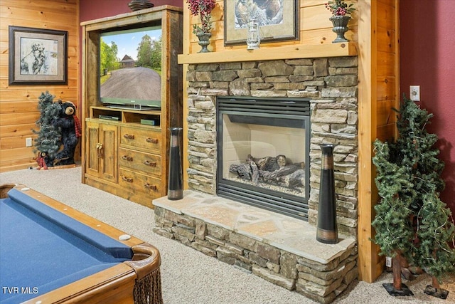 2213 Woodcock Trl, Sevierville, TN 37876 - living area with carpet floors, wood walls, a stone fireplace, and billiards