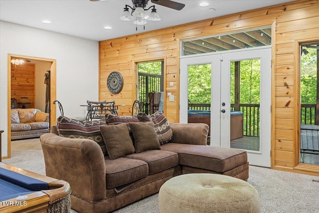 2213 Woodcock Trl, Sevierville, TN 37876 - carpeted living room featuring a ceiling fan, healthy amount of natural light, recessed lighting, wooden walls, and french doors