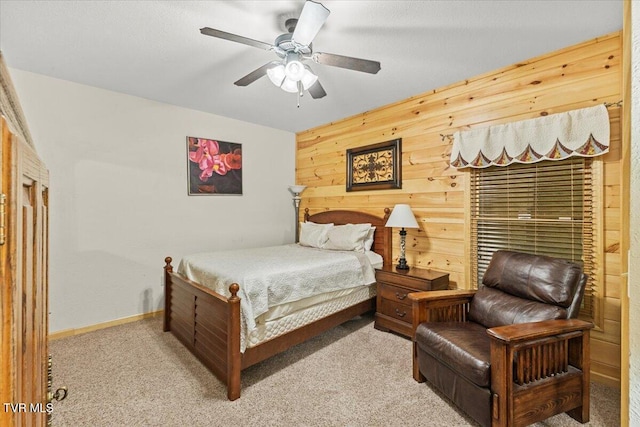 2213 Woodcock Trl, Sevierville, TN 37876 - carpeted bedroom with wood walls, a ceiling fan, and baseboards