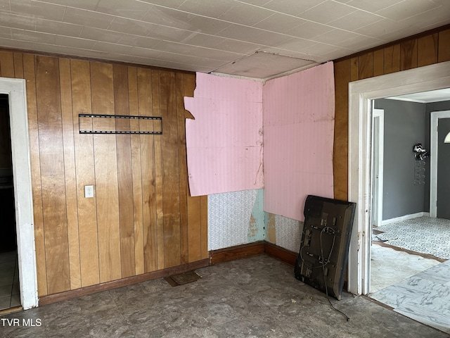 276 Spurgeon Ln, Bristol, VA 24201 - unfurnished room with wood walls, tile patterned floors, and baseboards