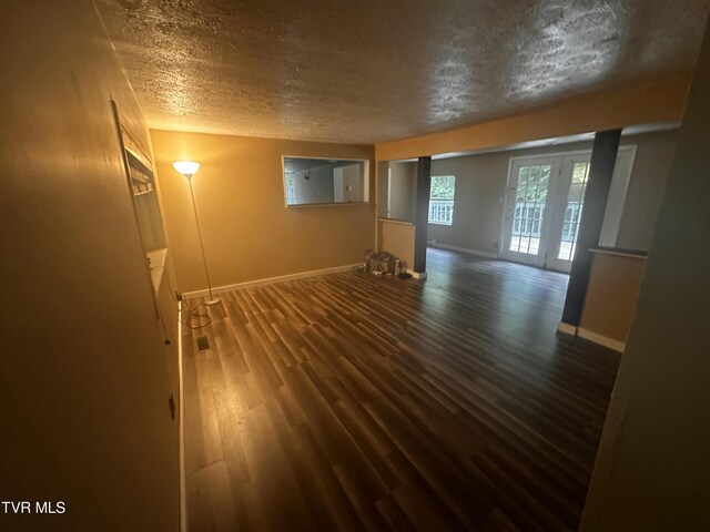 11510 Dogwood Ln, Pound, VA 24279 - spare room with a textured ceiling, baseboards, and dark wood-style floors