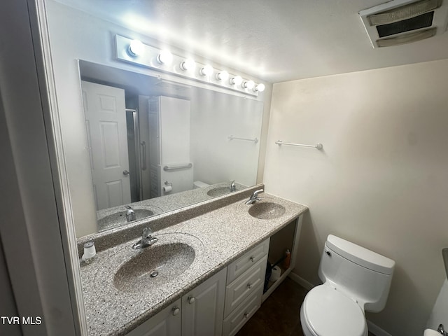 11510 Dogwood Ln, Pound, VA 24279 - bathroom with toilet, double vanity, a shower, baseboards, and tile patterned flooring