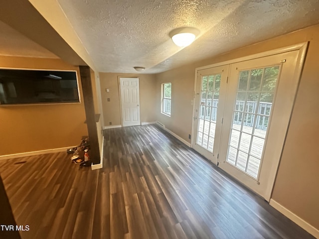 11510 Dogwood Ln, Pound, VA 24279 - unfurnished living room with a textured ceiling, baseboards, and wood finished floors