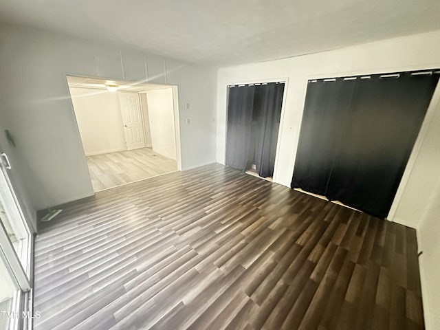11510 Dogwood Ln, Pound, VA 24279 - unfurnished bedroom with wood finished floors and two closets