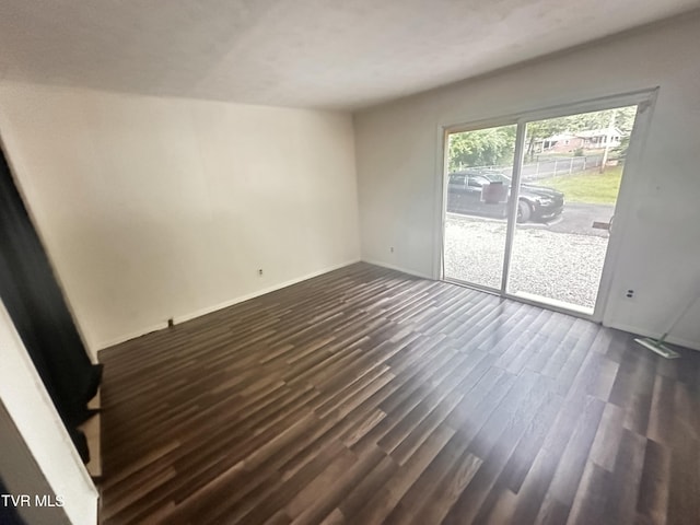 11510 Dogwood Ln, Pound, VA 24279 - spare room featuring dark wood-type flooring and baseboards
