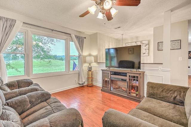 118 Greenmeadow Ln, Jonesborough, TN 37659 - living room with a textured ceiling, a ceiling fan, and wood finished floors
