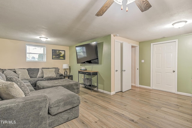 118 Greenmeadow Ln, Jonesborough, TN 37659 - living room featuring light wood finished floors, baseboards, a textured ceiling, and ceiling fan