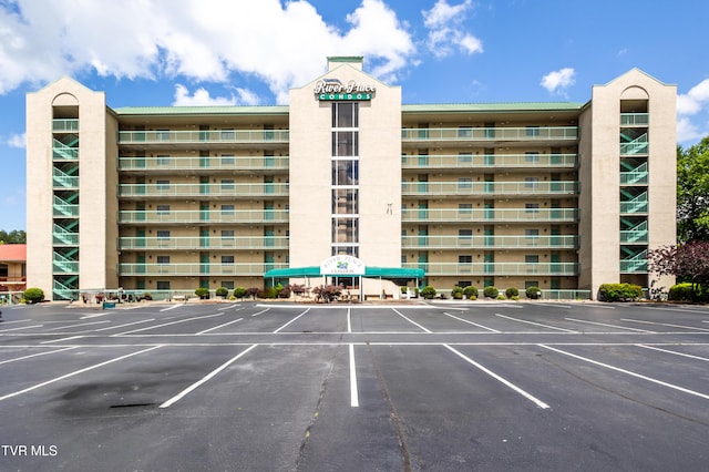 3215 N River Rd Unit 106, Pigeon Forge, TN 37863 - view of apartment building / complex featuring uncovered parking