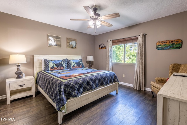 3215 N River Rd Unit 106, Pigeon Forge, TN 37863 - bedroom featuring dark wood-style floors, baseboards, and a ceiling fan