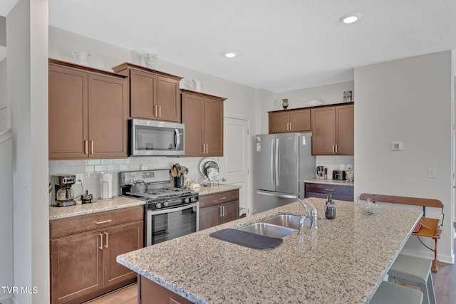 936 Pampas Dr, Jonesborough, TN 37659 - kitchen with stainless steel appliances, a breakfast bar area, light stone counters, and recessed lighting