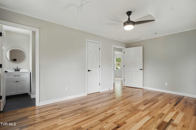 5530 Paramont Rd, Wise, VA 24293 - unfurnished bedroom with light wood-type flooring, a sink, baseboards, ornamental molding, and connected bathroom