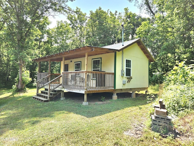 2428 Middle Creek Rd, Afton, TN 37616 - back of property with a lawn and metal roof