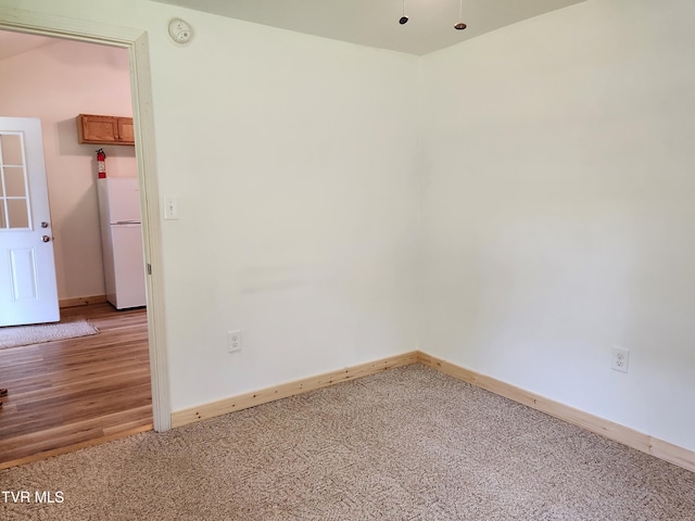 2428 Middle Creek Rd, Afton, TN 37616 - empty room featuring baseboards, a smoke detector, and light carpet
