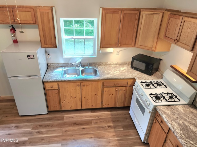 2428 Middle Creek Rd, Afton, TN 37616 - kitchen featuring white appliances, a sink, and light wood-type flooring