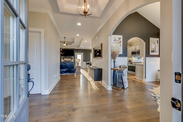 1132 Panoramic Vis, Gray, TN 37615 - entrance foyer with a tray ceiling, ornamental molding, dark wood-style flooring, ceiling fan, and arched walkways