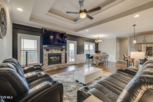 1132 Panoramic Vis, Gray, TN 37615 - living room with wood finished floors, a ceiling fan, a chandelier, a fireplace, and crown molding
