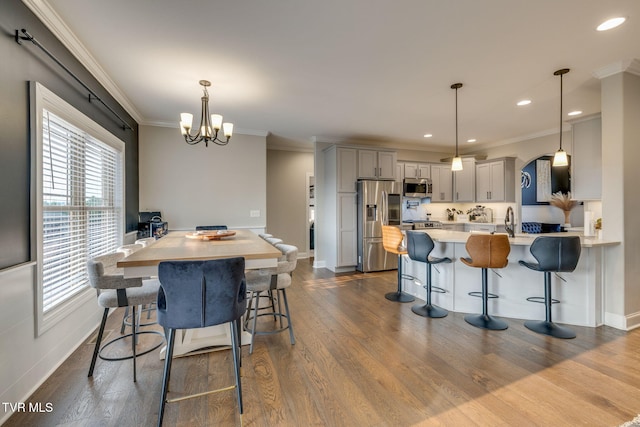 1132 Panoramic Vis, Gray, TN 37615 - dining room featuring a chandelier, crown molding, dark wood-style floors, recessed lighting, and arched walkways