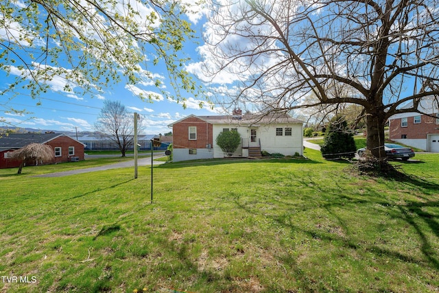 173 Keller Ln, Marion, VA 24354 - view of front of property with a front lawn, brick siding, and a chimney