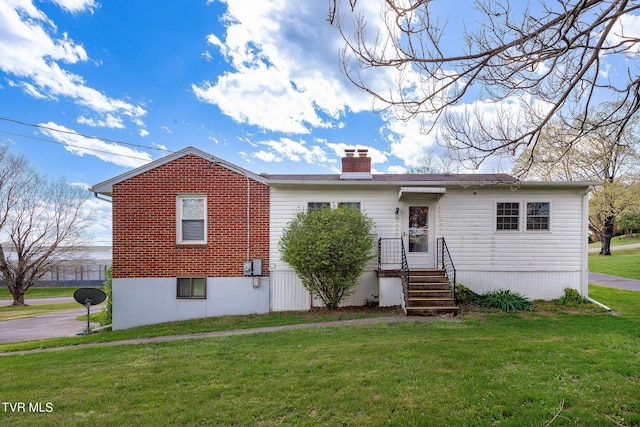 173 Keller Ln, Marion, VA 24354 - back of property featuring a yard, a chimney, and brick siding